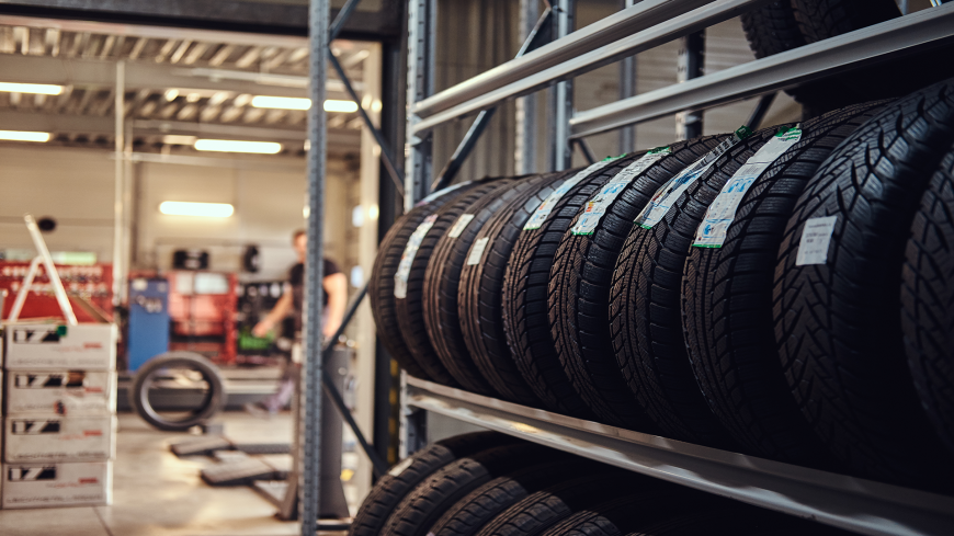 New Tires on a auto shop's racks